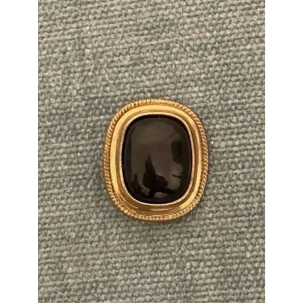Black and Gold-Colored Button